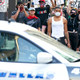 DALLAS, TX - JUNE 06: Demonstrators march past a Dallas Police car during a peaceful protest against police brutality and racism on June 6, 2020 in Dallas, Texas. This is the 12th day of protests since George Floyd died in Minneapolis police custody on May 25.